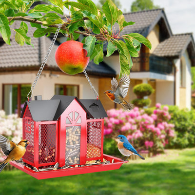 red hanging metal barn bird feeder showing seed window